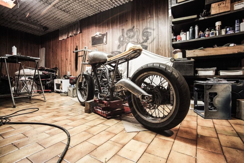 Working on Motorcycle in Garage